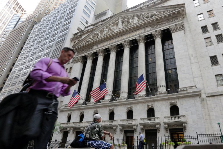 In this June 24, 2016, file photo, a man walks by the New York Stock Exchange. The U.S. stock market opens at 9:30 a.m. EDT on Friday, Oct. 12, 2018. (Richard Drew/AP Photo, File)