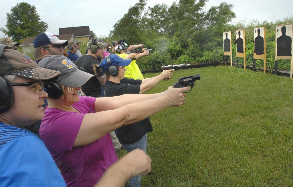 Teacher Gun Class Educators fire off rounds during a concealed carry class for teachers Sunday, June 10, 2018, at Adventure Tactical Training in Farmer City, Illinois. The class was designed to help teachers feel less vulnerable in the wake of a number of recent school shootings across the country. (David Proeber, The Pantagraph via AP)