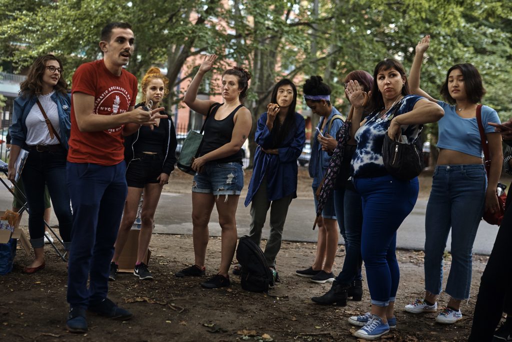 Campaigning Sex Workers An organizer for the Democratic Socialists of America, second from left in red shirt, coaches sex workers and allies before they canvass for Julia Salazar, who is running for a seat in the New York State Senate. Salazar supports decriminalizing sex work and repealing laws that target people in the sex industry. (AP Photo/Andres Kudacki)