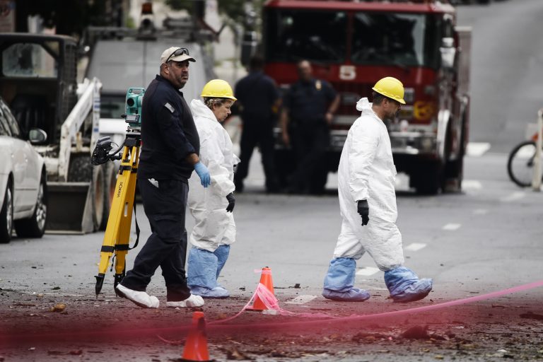 Authorities investigate the scene of this Saturday's fatal car explosion in Allentown, Pa., Monday, Oct. 1, 2018. (AP Photo/Matt Rourke)