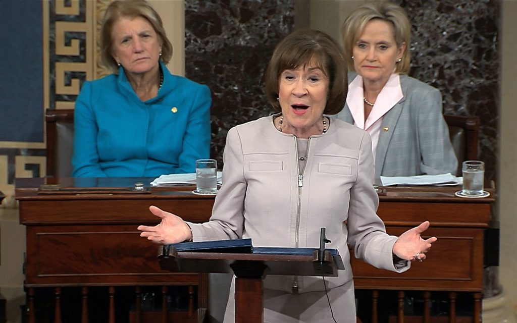 Supreme Court Kavanaugh In this image from video provided by Senate TV, Sen. Susan Collins, R-Maine., speaks on the Senate floor about her vote on Supreme Court nominee Judge Brett Kananaugh, Friday, Oct. 5, 2018 in the Capitol in Washington. Sen Shelly Capito, R-W.Va., sits rear left and Sen. Cindy Hyde-Smith, R-Miss., sits right. (Senate TV via AP)