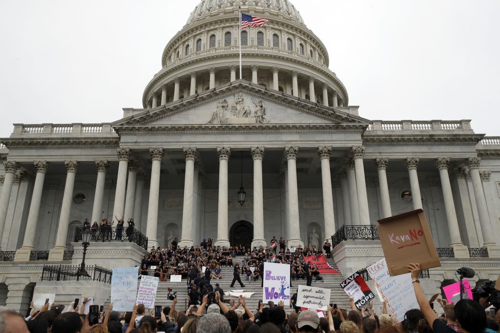 Supreme Court Kavanaugh Activists are arrested by Capitol Hill Police officers after occupying the steps on the East Front of the U.S. Capitol as they protest the confirmation vote of Supreme Court nominee Brett Kavanaugh on Capitol Hill, Saturday, Oct. 6, 2018 in Washington. (Alex Brandon/AP Photo)