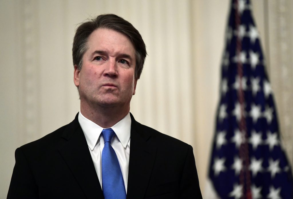 Donald Trump, Brett Kavanaugh Supreme Court Justice Brett Kavanaugh stands before a ceremonial swearing-in in the East Room of the White House in Washington, Monday, Oct. 8, 2018. (Susan Walsh/AP Photo)