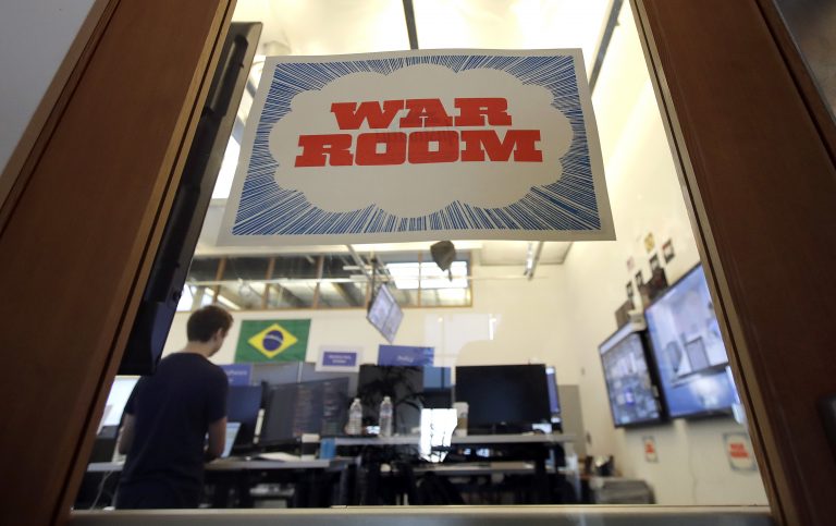 A man works at his desk in the war room, where Facebook monitors election related content on the platform, in Menlo Park, Calif., Wednesday, Oct. 17, 2018. (Jeff Chiu/AP Photo)