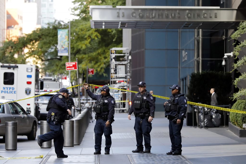 New York City Police Dept. officers arrive outside the Time Warner Center, in New York, Wednesday, Oct. 24, 2018. A police bomb squad was sent to CNN's offices in New York City and the newsroom was evacuated because of a suspicious package. (Richard Drew/AP Photo)