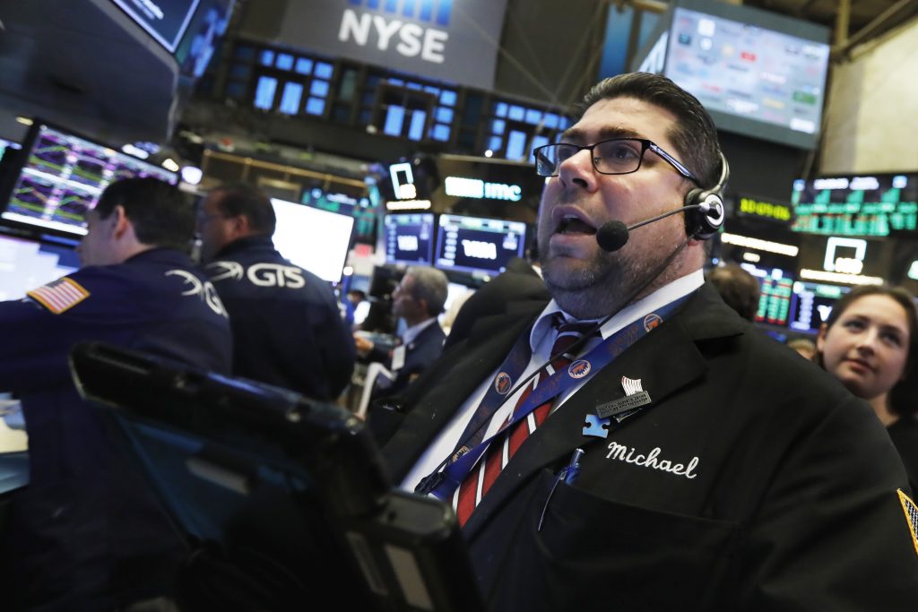 Trader Michael Capolino works on the floor of the New York Stock Exchange, Thursday, Oct. 25, 2018. Strong results from major companies including Microsoft, Visa and Comcast are sending U.S. stocks higher Thursday morning as the market found its footing after three weeks of steep declines. (Richard Drew/AP Photo)