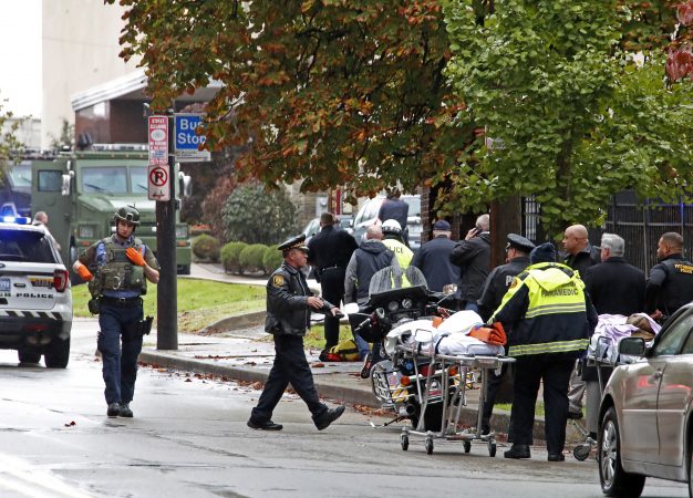 First responders surround the Tree of Life Synagogue, rear center, where a shooter opened fire Saturday, Oct. 27, 2018, wounding three police officers and causing 