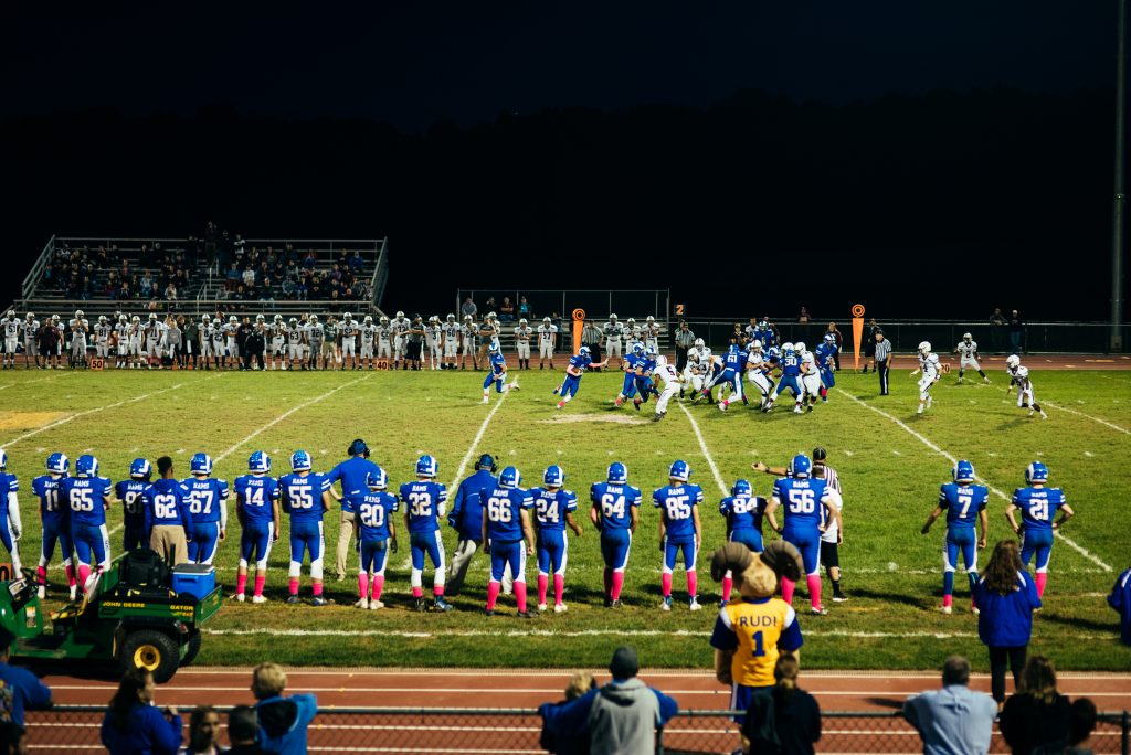 A player running the ball during the Kennard-Dale homecoming football game. (Dani Fresh for WHYY)