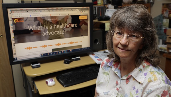 In this Aug. 22, 2018 photo, April Box poses for a photo at her home in Spokane, Wash. Box is a healthcare advocate and runs a website to help guide people through major surgeries and other aspects of the healthcare system.  (Ted S. Warren/AP Photo)