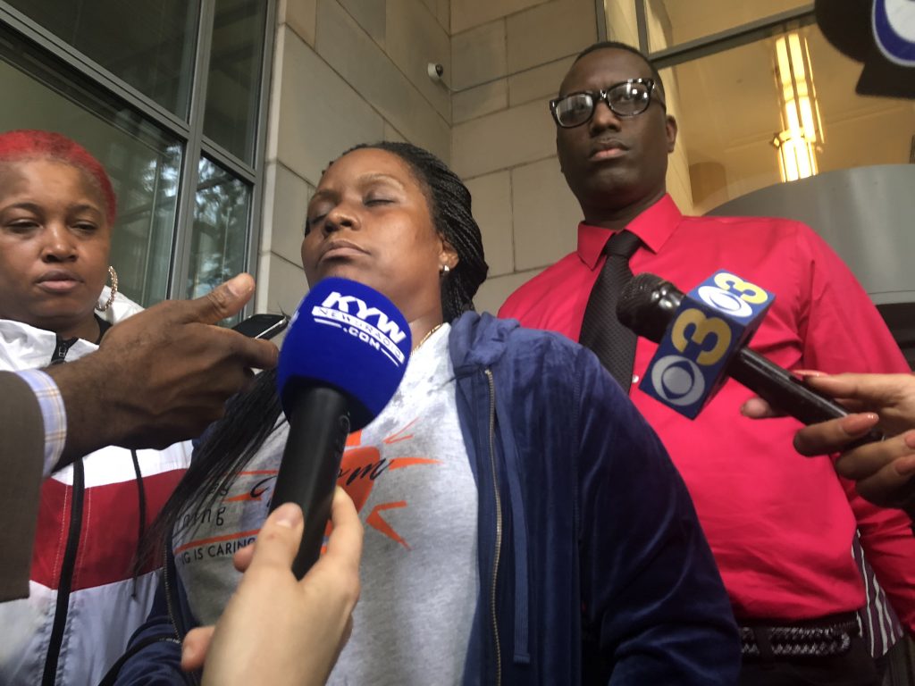 IMG_4072 Donna Clement-Jackson, the godmother of David Jones, stands with other supporters of Jones after a court hearing for former Philadelphia Police officer Ryan Pownall, who is being charged in the death of Jones. (Bobby Allyn/WHYY)