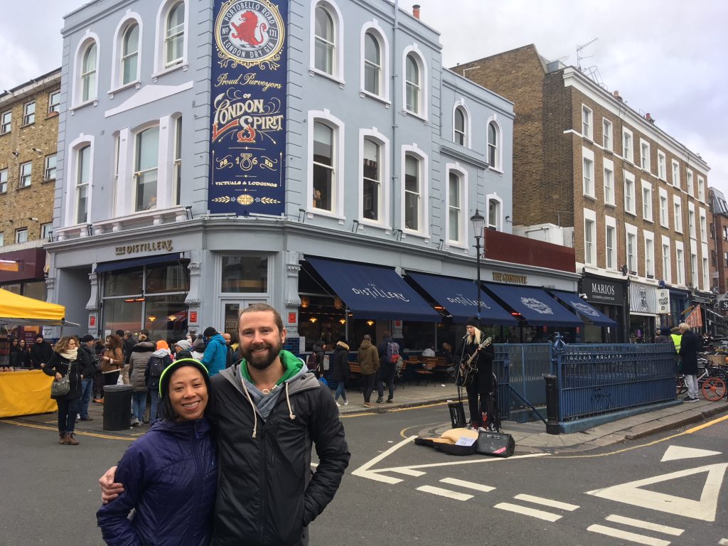 IMG_7172 Melanie Manuel, left, and Chris Thomas on Portobello Road, just a block from their Notting Hill flat in London. Like thousands of other Pennsylvanians living abroad, Manuel and Thomas were initially blocked from applying for their absentee ballots because the Pa. Department of State website can’t be accessed from a foreign country (Jim Saksa/WHYY)