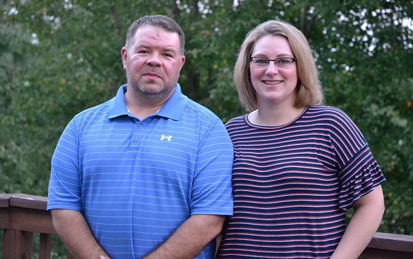 Mary and Rick Lacey stand for a portrait outside their home in Camp Hill, Cumberland County. They say their 8-year-old son Taylor, who has special needs, has benefited from applied Behavioral Analysis. (Brett Sholtis/Transforming Health)