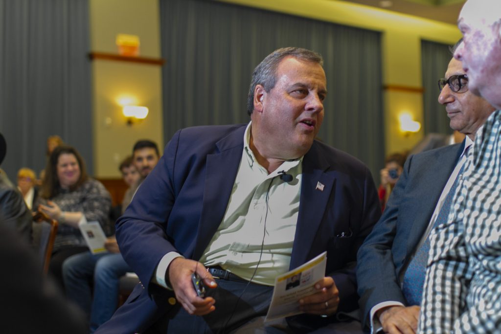 Former New Jersey Governor Chris Christie appear for the first time at an event at Rowan University Former New Jersey Governor Chris Christie talks with Rowan University President Ali A. Houshmand during an event at the school titled