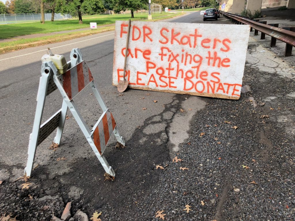 a-sign-at-one-of-the-potholes-under-repair-by-local-skaters.original Skaters from FDR Skatepark set up a sign and