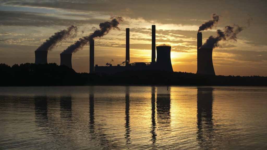 In this June 3, 2017, file photo, the coal-fired Plant Scherer stands in the distance in Juliette, Ga. (Branden Camp/AP)