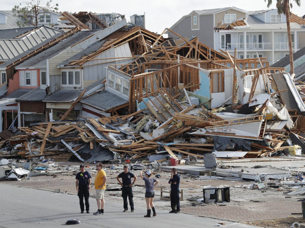 ap_18284574149825-df4cd7786ef25189b7cab722efcd5c73c312da66-s2500-c85 Rescue personnel search for people who may need help in Mexico Beach, Fla., on Thursday, one day after Hurricane Michael made landfall near the area. (Gerald Herbert/AP)