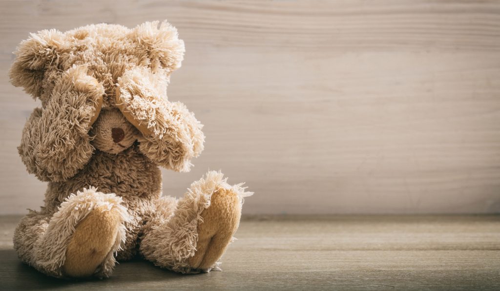 Child Abuse Concept. Teddy Bear Covering Eyes Teddy bear covering eyes. (Photo Courtesy/BigStock)