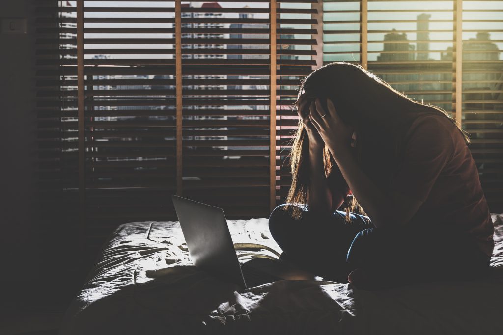 Researchers have found that, in the six months leading up to the diagnosis, depressed patients made more frequent posts about crying, physical symptoms of headaches and pain, or used “I and me” statements a lot. (Tzido/BigStock)