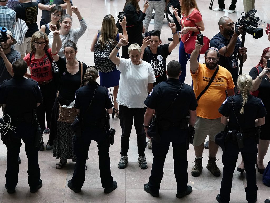 Activists chant during a protest outside the office of Senate Judiciary Committee Chairman Chuck Grassley of Iowa. Activists chant during a protest outside the office of Senate Judiciary Committee Chairman Chuck Grassley of Iowa.