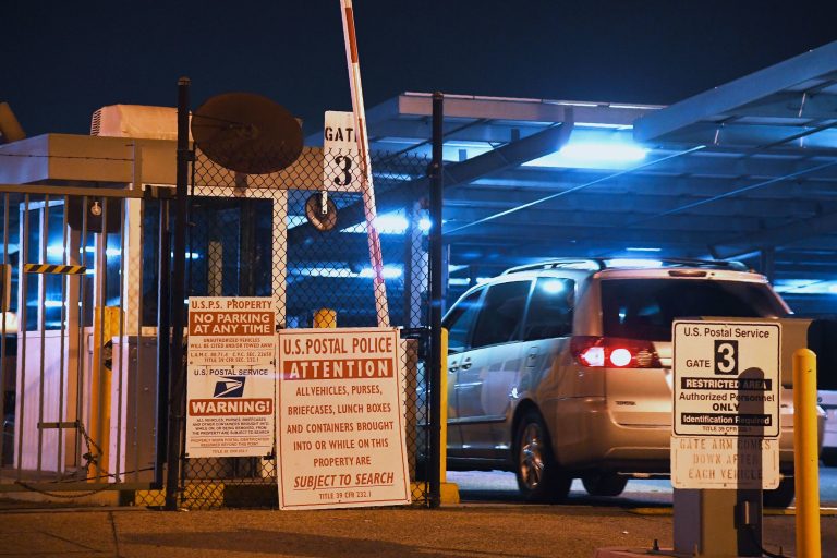 A car enters the United States Postal Service Processing and Distribution Center in Los Angeles on Wednesday.
(Robyn Beck/AFP/Getty Images)