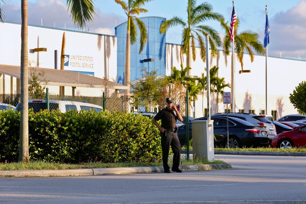 Police outside the U.S. Post Office Royal Palm Processing & Distribution Center, in Opa-locka, Fla. on Thursday. Police outside the U.S. Post Office Royal Palm Processing