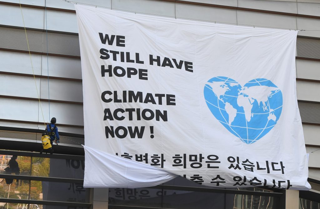 Greenpeace activists hang a banner prior to a press conference of the Intergovernmental Panel for Climate Change (IPCC) in Incheon, South Korea. The landmark U.N. report on limiting global warming to 1.5 degrees Celsius was released after a week-long meeting of the IPCC’s 195 member nations. Greenpeace activists hang a banner prior to a press conference of the Intergovernmental Panel for Climate Change (IPCC) in Incheon, South Korea. The landmark U.N. report on limiting global warming to 1.5 degrees Celsius was released after a week-long meeting of the IPCC's 195 member nations.