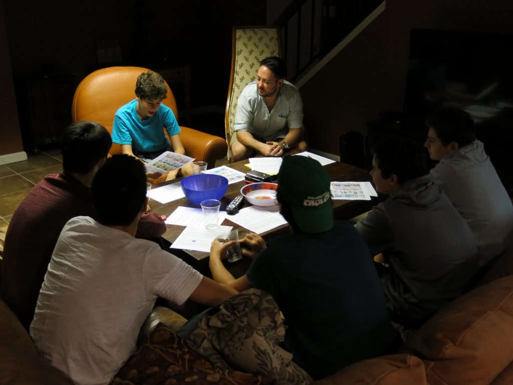 Cody Greenes (center), 35, group leader with the Jewish organization Moving Traditions, leads six high school freshman boys in a discussion about sexual assault and consent. Cody Greenes (center), 35, group leader with the Jewish organization Moving Traditions, leads six high school freshman boys in a discussion about sexual assault and consent.