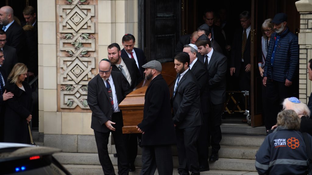 Pallbearers carry the caskets of brothers Cecil Rosenthal, 59, and David Rosenthal, 54, on Tuesday in Pittsburgh, Pa. The brothers were among 11 killed in the mass shooting at the Tree of Life Synagogue last Saturday. Pallbearers carry the caskets of brothers Cecil Rosenthal, 59, and David Rosenthal, 54, on Tuesday in Pittsburgh, Pa. The brothers were among 11 killed in the mass shooting at the Tree of Life Synagogue last Saturday.