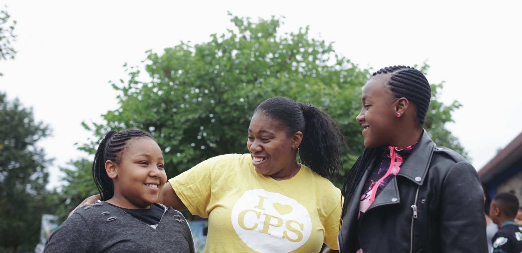 Sisters Kayla (left) and Kiarra Sils, seen here with their mom, say they're excited to visit the Discovery Center. (Neal Santos for PlanPhilly)