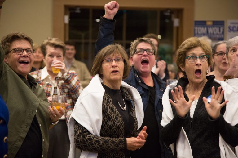 Frankie Franceschini, Linda McCarthy, Bonnie Shuman, and Sandy McCarthy (left to right) react as results come in for the 2018 midterm elections November 6th 2018 in Swarthmore, PA. (Emily Cohen for WHYY)