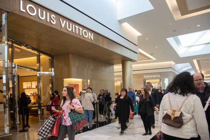 As shoppers make their way to stores others wait in lines outside the stores for their turn to shop on Black Friday at the King of Prussia Mall in Pennsylvania November 23rd 2018. (Emily Cohen for WHYY)