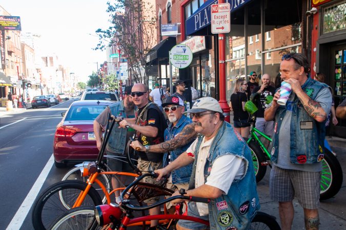 Dirk, Spin, and Big Cam sit on their bikes as the gang gets ready to head to Locust Bar (Brad Larrison for WHYY)