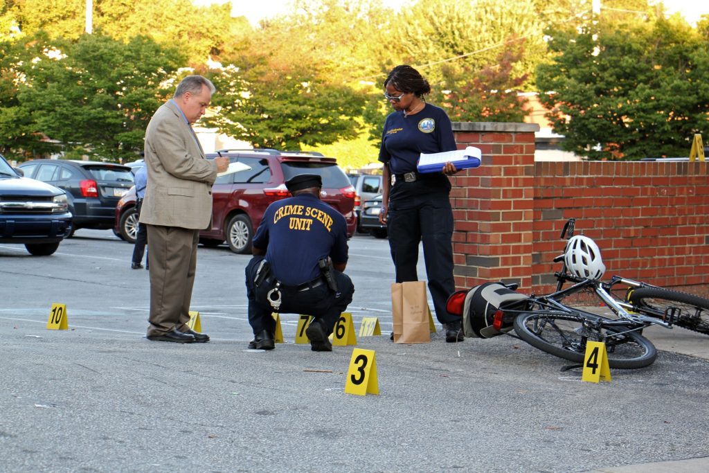 2018 10 03-e lee-philadelphia germantown dollar general-drive by shooting gun violence Police investigate a drive-by shooting in Germantown on Oct. 3, 2018. Five young men aged 19 to 23 were shot. One died.