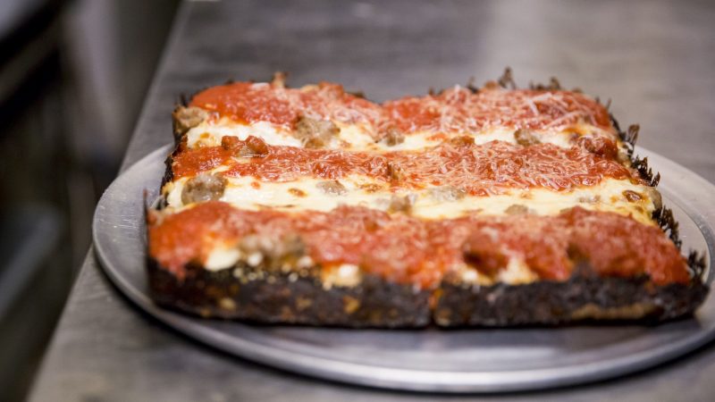 A plain pie sits in the kitchen at W/N W/N coffee bar. Resident chef Daniel Gutter makes Detroit style pizzas out of their kitchen from Wednesday to Sunday. (Rachel Wisniewski for WHYY)
