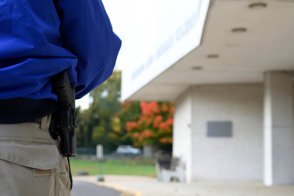 Security guard Donald Mee stands near the entrance of Congregation Adath Jeshurun, in Elkins Park, on Wednesday, Oct. 31, 2018. (Bastiaan Slabbers for WHYY)