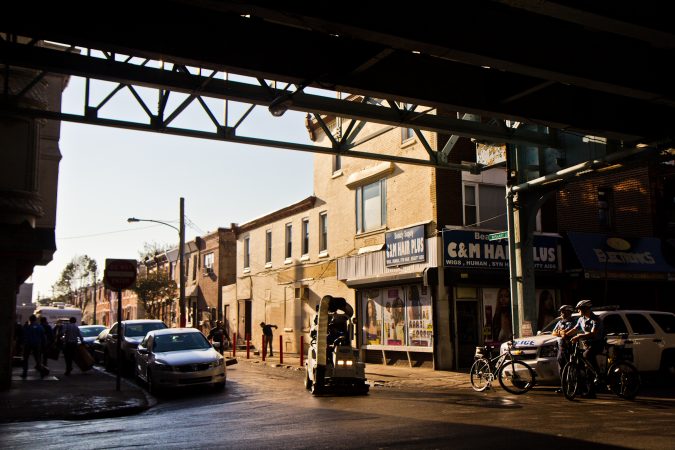 City workers and community groups work to clean up the streets of Kensington. (Kimberly Paynter/WHYY)