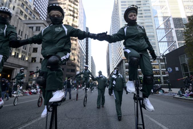 Woodside One Wheelers (WOW) of Woodside Elementary School from Topsham, Maine takes part in the 99th annual Thanksgiving Day Parade, in Center City Philadelphia. (Bastiaan Slabbers for WHYY)