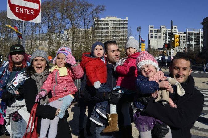 Kids see the float carrying Mr. and Mrs. Claus roll past during the 99th annual Thanksgiving Day Parade in Center City Philadelphia. (Bastiaan Slabbers for WHYY)