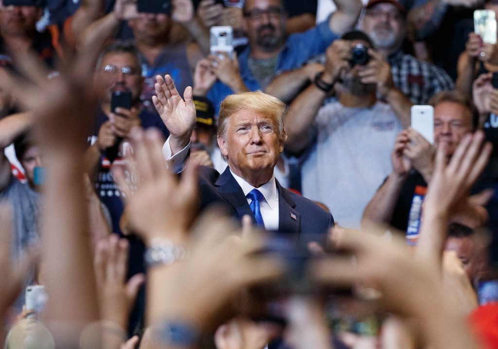 Donald Trump President Donald Trump waves to the cheering crowd as he arrives for a rally, Thursday, Aug. 2, 2018, at Mohegan Sun Arena at Casey Plaza in Wilkes Barre, Pa..