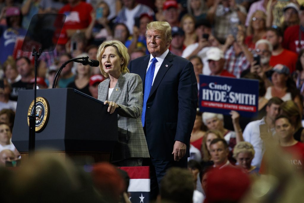 Donald Trump President Donald Trump watches as Sen. Cindy Hyde-Smith, R-Miss., speaks during a campaign rally at the Landers Center Arena, Tuesday, Oct. 2, 2018, in Southaven, Miss. (AP Photo/Evan Vucci)