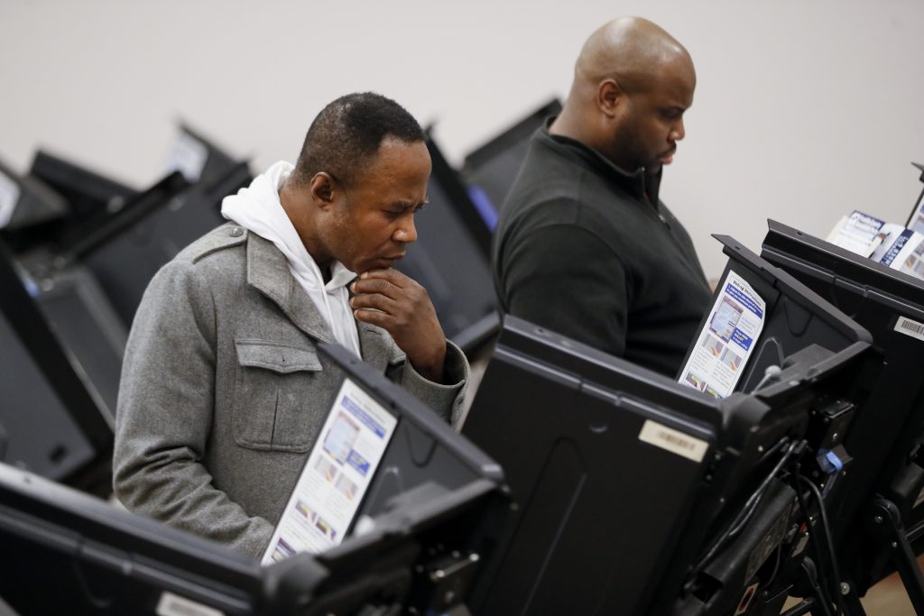 Election 2018 Early Voting Ohio Voters use electronic polling machines as they cast their votes early at the Franklin County Board of Elections, Wednesday, Oct. 31, 2018, in Columbus, Ohio. (John Minchillo/AP Photo)
