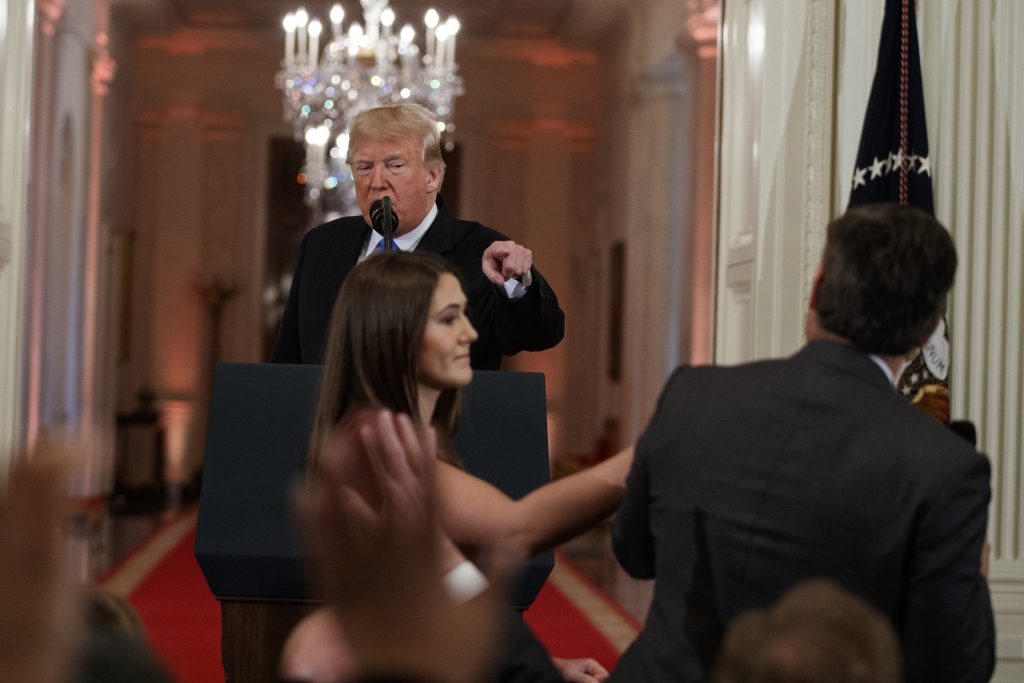 Donald Trump, Jim Acosta President Donald Trump looks on as a White House aide attempts to take away a microphone from CNN journalist Jim Acosta during a news conference in the East Room of the White House, Wednesday, Nov. 7, 2018, in Washington. (Evan Vucci/AP Photo)