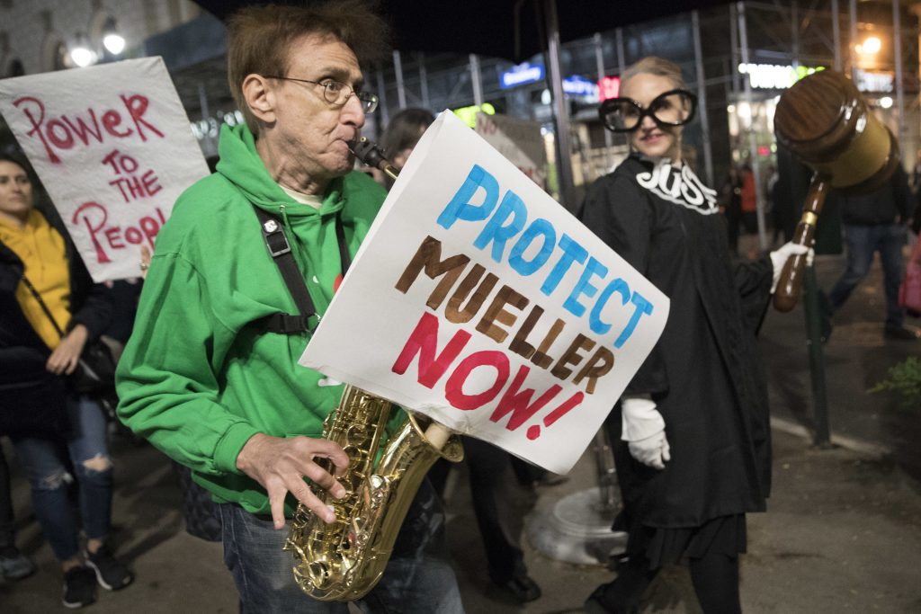 Russia Probe Protests Protesters march through Times Square during a demonstration in support of special counsel Robert Mueller, Thursday, Nov. 8, 2018, in New York. A protest in New York City has drawn several hundred people calling for the protection of Mueller's investigation into potential coordination between Russia and President Donald Trump's campaign. (Mary Altaffer/AP Photo)
