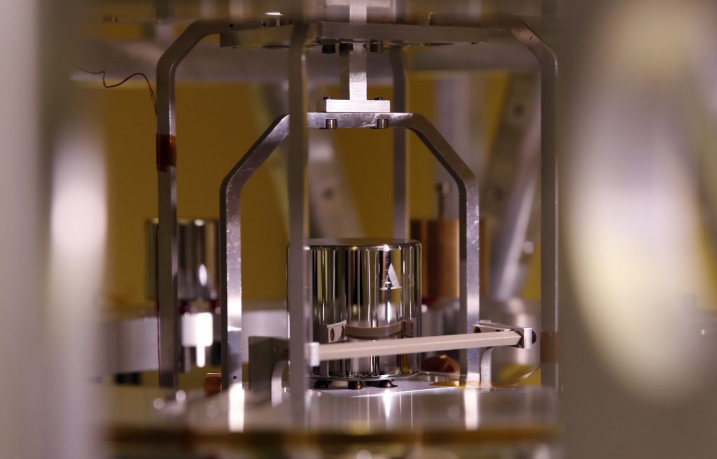 France Updating the Kilo In this photo taken Wednesday, Oct. 17, 2018, a weight is set up at the International Bureau of Weights and Measures, in Sevres, near Paris. The golf ball-sized metal cylinder at the heart of the world's system for measuring mass is heading into retirement. Gathering this week in Versailles, west of Paris, governments on Friday Nov. 16, 2018, are expected to approve a plan to instead use a scientific formula to define the exact weight of a kilo. (Christophe Ena/AP Photo)