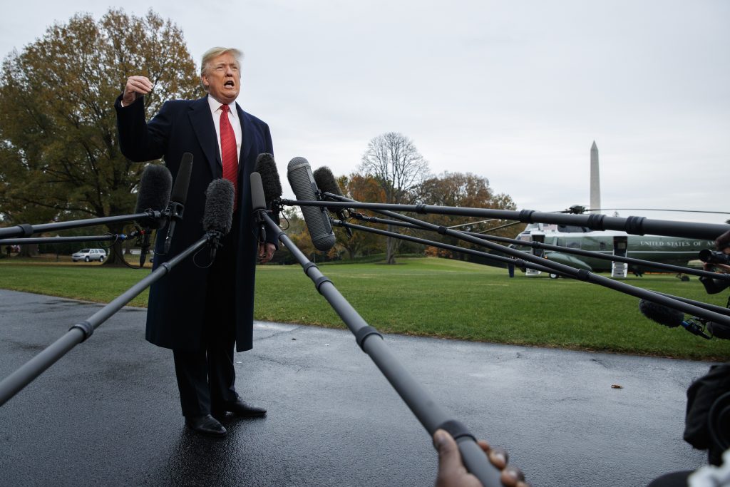 Donald Trump President Donald Trump talks with reporters before departing for France on the South Lawn of the White House, Friday, Nov. 9, 2018, in Washington. (AP Photo/Evan Vucci)