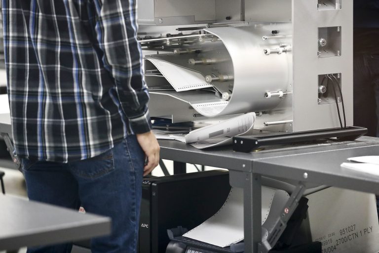 Elections staff prepare the machines for a recount at the Broward County Supervisor of Elections office on Sunday, Nov. 11, 2018, in Lauderhill, Fla. (AP Photo/Brynn Anderson)