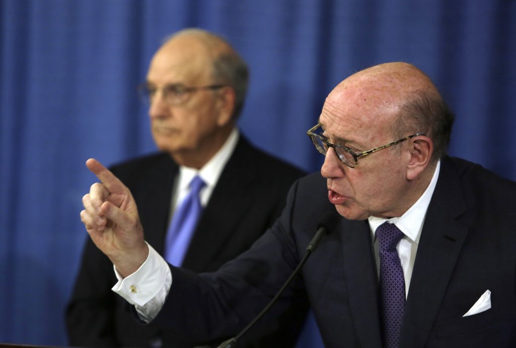 Ken Feinberg, George Mitchell Ken Feinberg addresses a reporter's question during a news conference Tuesday Nov. 13, 2018, in Philadelphia. Feinberg and Camille Biros, not pictured, are administrators of claims submitted to the Independent Reconciliation and Reparations Program, a new clergy child sexual abuse victim compensation fund set up by the Roman Catholic Archdiocese of Philadelphia. George Mitchell, background, is chairing the committee. (Jacqueline Larma/AP Photo)