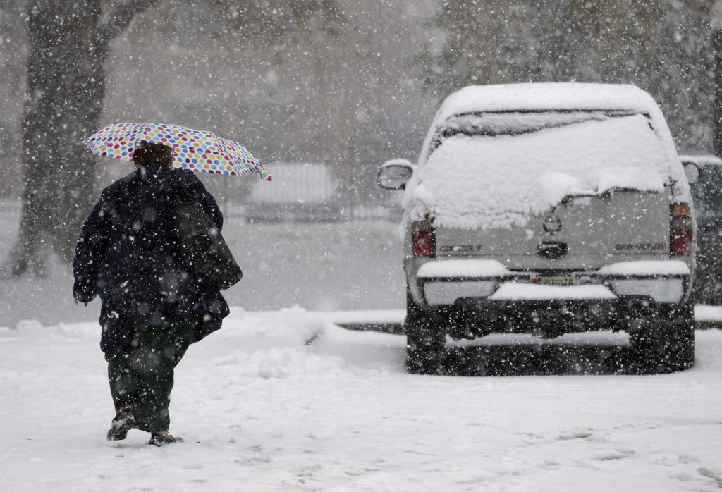 Wintry Weather A pedestrian makes her way through wintry weather in Mt. Holly, N.J., Thursday, Nov. 15, 2018. A mix of rain, sleet and snow started falling late Thursday morning in southern areas and was expected to soon move across the state. (Seth Wenig/AP Photo)