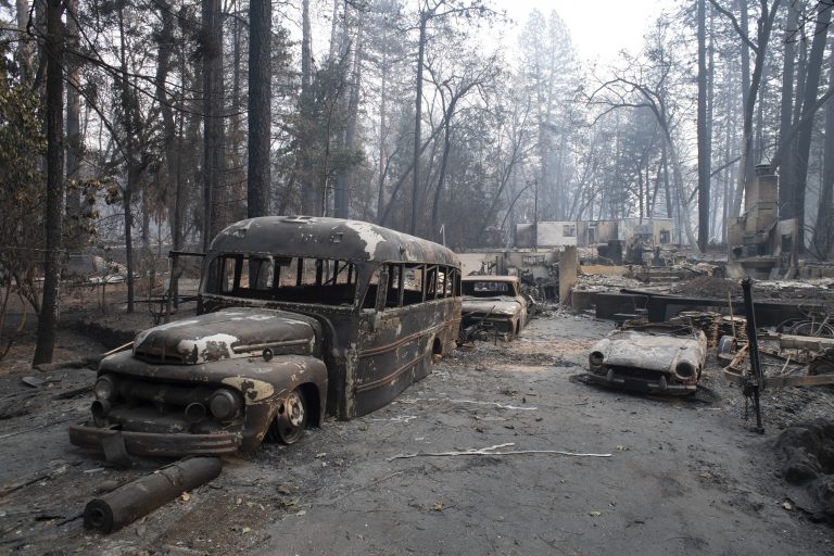 Burnt vehicles are seen in front of a destroyed house in Paradise, California, United States on November 16, 2018. Camp Fire has burnt so far 142,000 acres and is at 45% contained by Cal Fire. The death toll from the wild fire climbed to 63 with 631 on missing list. (Yichuan Cao/Sipa USA)(Sipa via AP Images)