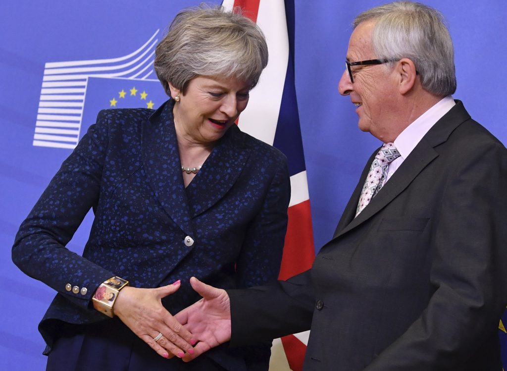 Theresa May, Jean-Claude Juncker European Commission President Jean-Claude Juncker (right), shakes hands with British Prime Minister Theresa May prior to a meeting at EU headquarters in Brussels, Saturday, Nov. 24, 2018. British Prime Minister Theresa May is kicking off a big Brexit weekend by traveling to EU headquarters in Brussels for talks on Saturday with key leaders. (Geert Vanden Wijngaert/AP)